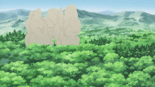 a large rock in the middle of a forest