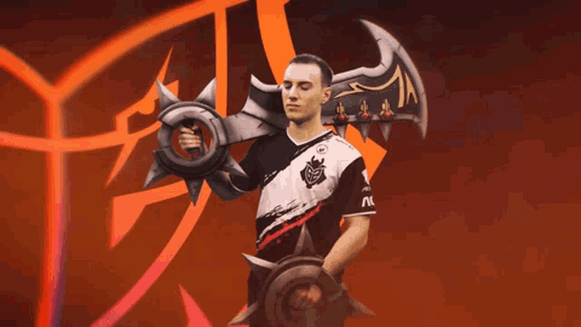 a man in a g2 jersey holds a large sword and shield