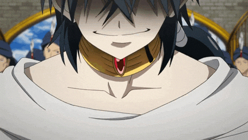 a close up of a person wearing a necklace with a red stone on it