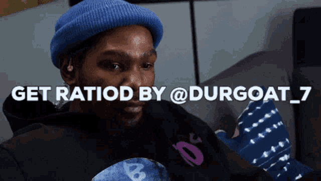 a man wearing a blue hat and a black hoodie says get ratiod by @ durgoat_7