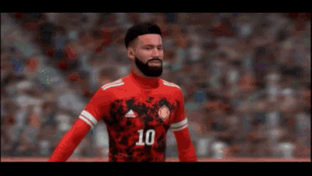 a man with a beard is wearing a red and black jersey with the number 10 on it