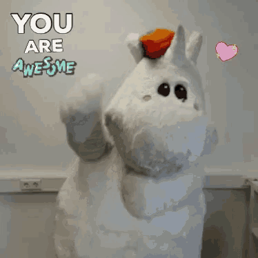 a stuffed animal in a unicorn costume with the words " you are awesome " above it