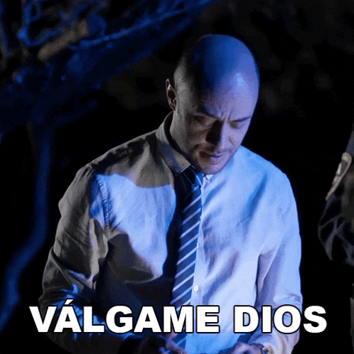 a bald man in a white shirt and tie says valgame dios in spanish