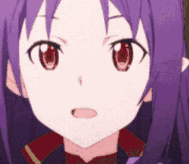 a close up of a girl 's face with purple hair