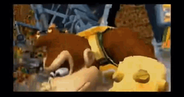 a cartoon monkey is eating a piece of cheese in a video game scene .