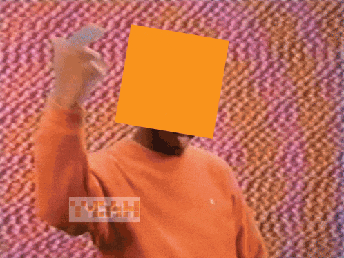 a man wearing an orange shirt has an orange square on his face and the words yeah yeah yeah yeah