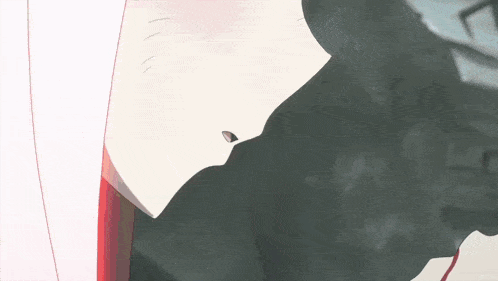 a girl with pink hair is laying on the ground next to a boy with black hair