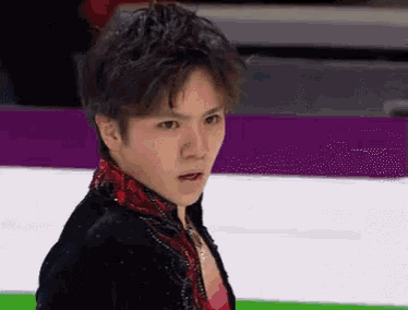a close up of a man 's face while ice skating .