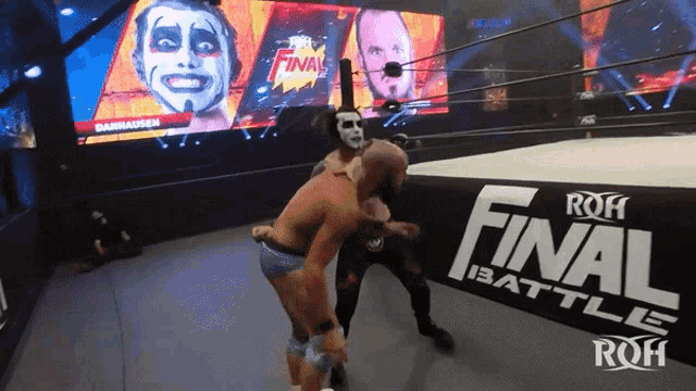 two wrestlers are in a ring with a sign that says roh final battle