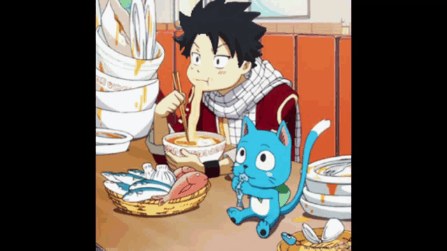a boy and a cat are sitting at a table eating noodles