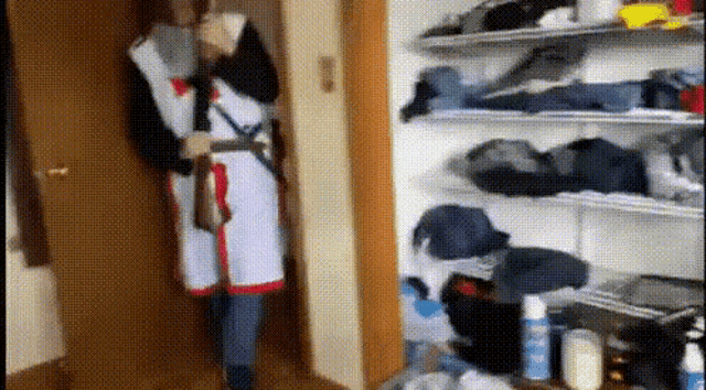 a person in a knight costume standing in a closet