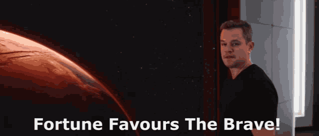 a man standing in front of a planet with the words " fortune favours the brave " above him