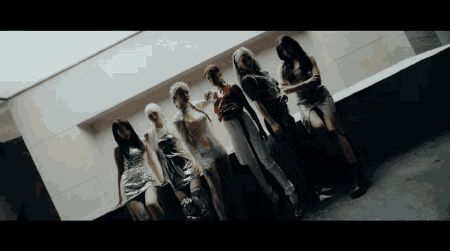 a group of women standing next to each other