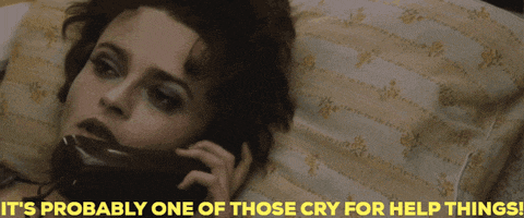 a woman laying on a bed talking on a phone with the caption it 's probably one of those cry for help