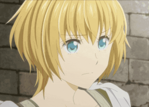 a girl with short blonde hair and blue eyes looks angry