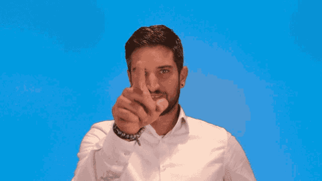 a man with a beard is making a middle finger sign