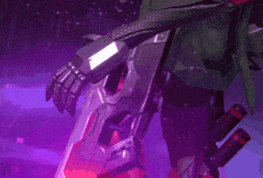a person is holding a gun with a purple light coming out of it 's barrel .