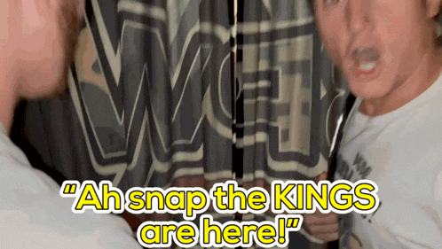 a man says " ah snap the kings are here " in front of a curtain
