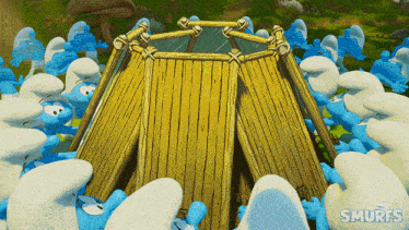 a bunch of smurfs are gathered around a wooden structure with smurfs written on the bottom