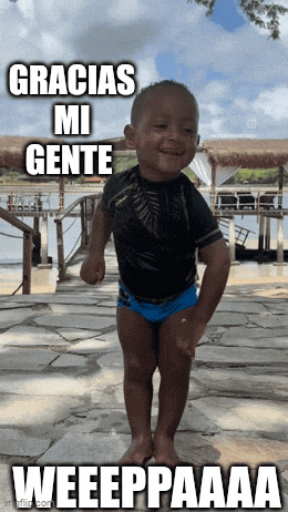 a little boy in a black shirt and blue swim trunks says gracias mi gente weeeppaaa