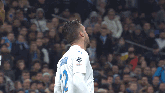 a soccer player wearing a white jersey with the number 10 on the front