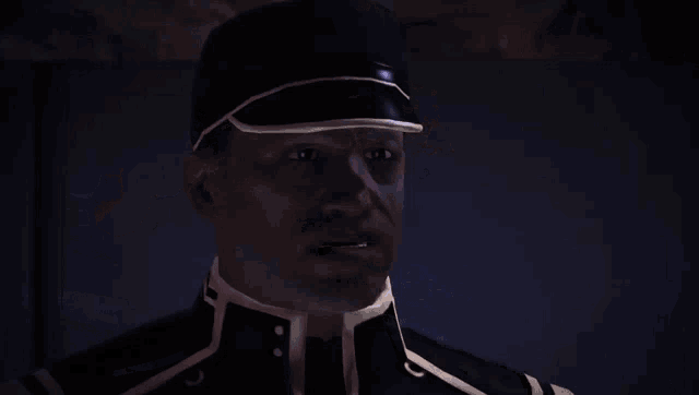 a man wearing a headset talks to another man in a dark room