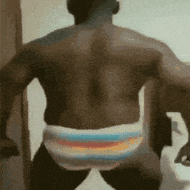 the back of a shirtless man wearing striped underwear is shown