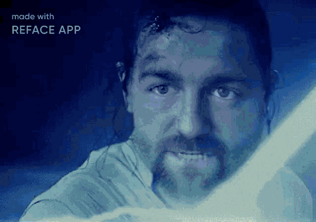 a man with a beard is holding a light saber in a reface app
