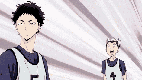 a couple of anime characters are standing next to each other and one of them is wearing a number 4 shirt .