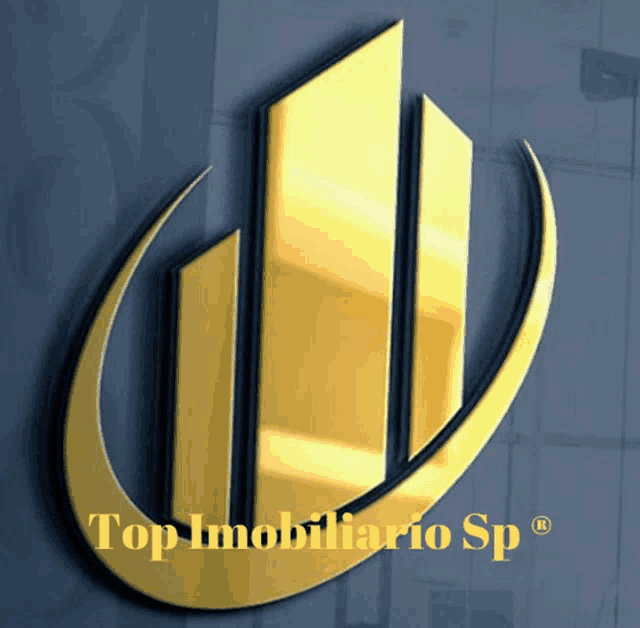 a logo for top imobiliario sp is displayed on a wall
