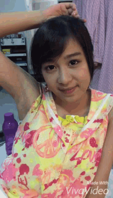 a girl in a pink and yellow dress is made with viva video