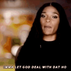 a woman in a black shirt says imma let god deal with dat ho