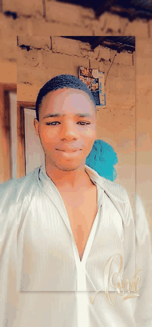a man in a white shirt with the word love in gold