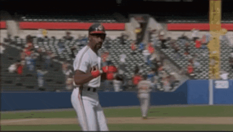 a baseball player wearing a helmet with the letter a on it stands on the field