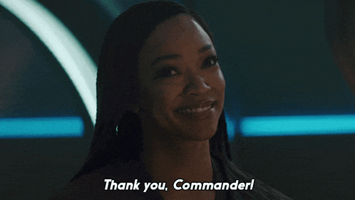 a woman says thank you commander and smiles