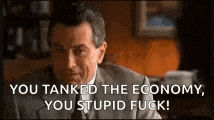 a man in a suit and tie is sitting at a table and says `` you tanked the economy , you stupid fuck ! ''