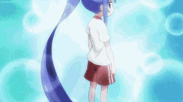 a girl with long blue hair is standing in the water .