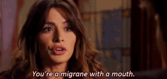 a woman is saying that she has a migraine with a mouth