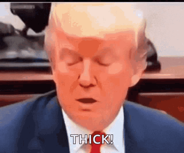 a close up of donald trump 's face with the words thick behind him