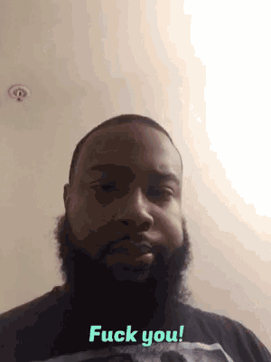 a man with a beard and a black shirt says fuck you
