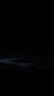 a close up of a glowing object with a black background