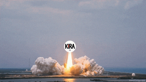 a man in a suit stands in front of a rocket that says kira 10