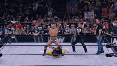 a wrestler in a ring with a sign that says jeff watt