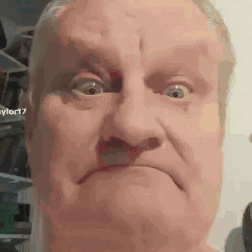 a close up of a man making a funny face with the number 17 in the corner