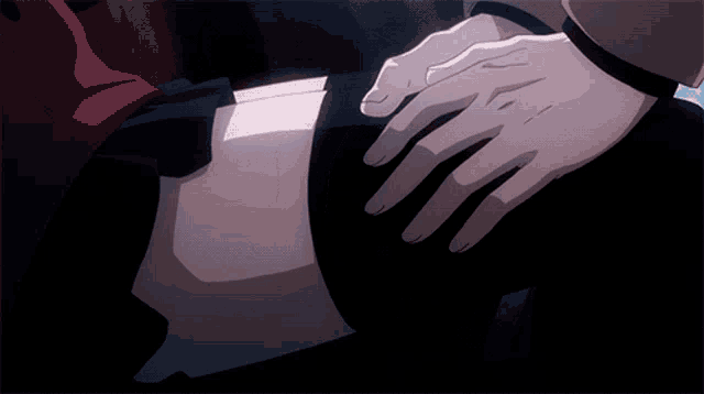 a person 's hand is on another person 's leg