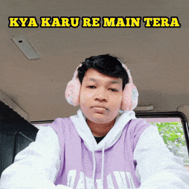 a man wearing headphones and a purple shirt with the words kya karu re main tera on the bottom