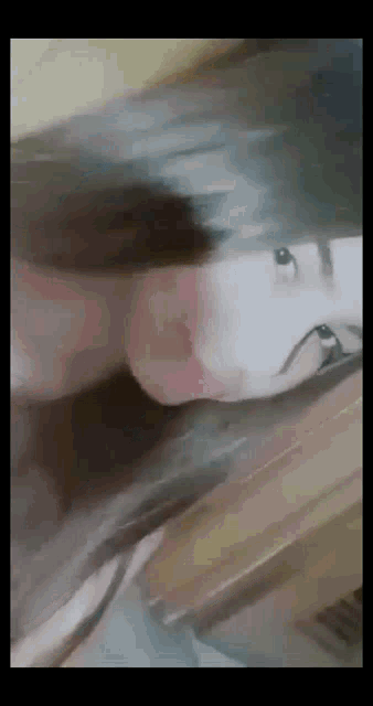 a close up of a woman 's face with a blurry background
