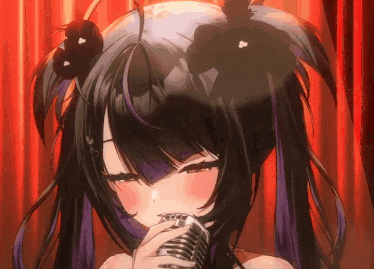 a girl with black hair and purple highlights is singing into a microphone