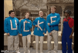 a group of people wearing blue sweaters with the word luck written on them