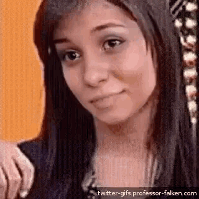 a close up of a woman 's face with a slight smile on her face .